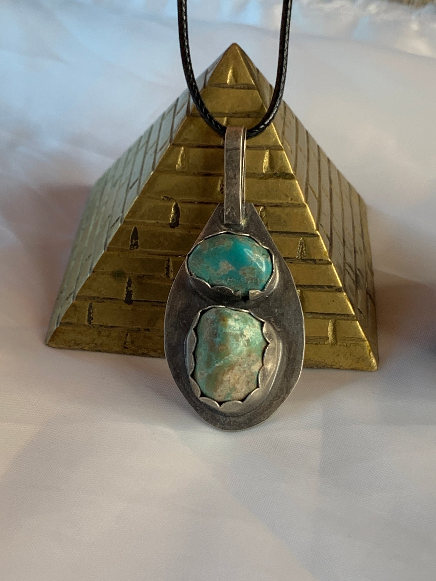 The pendant features a large, oxidized sterling silver setting that enhances the rustic and earthy feel, making it a unique and one-of-a-kind piece of art. 